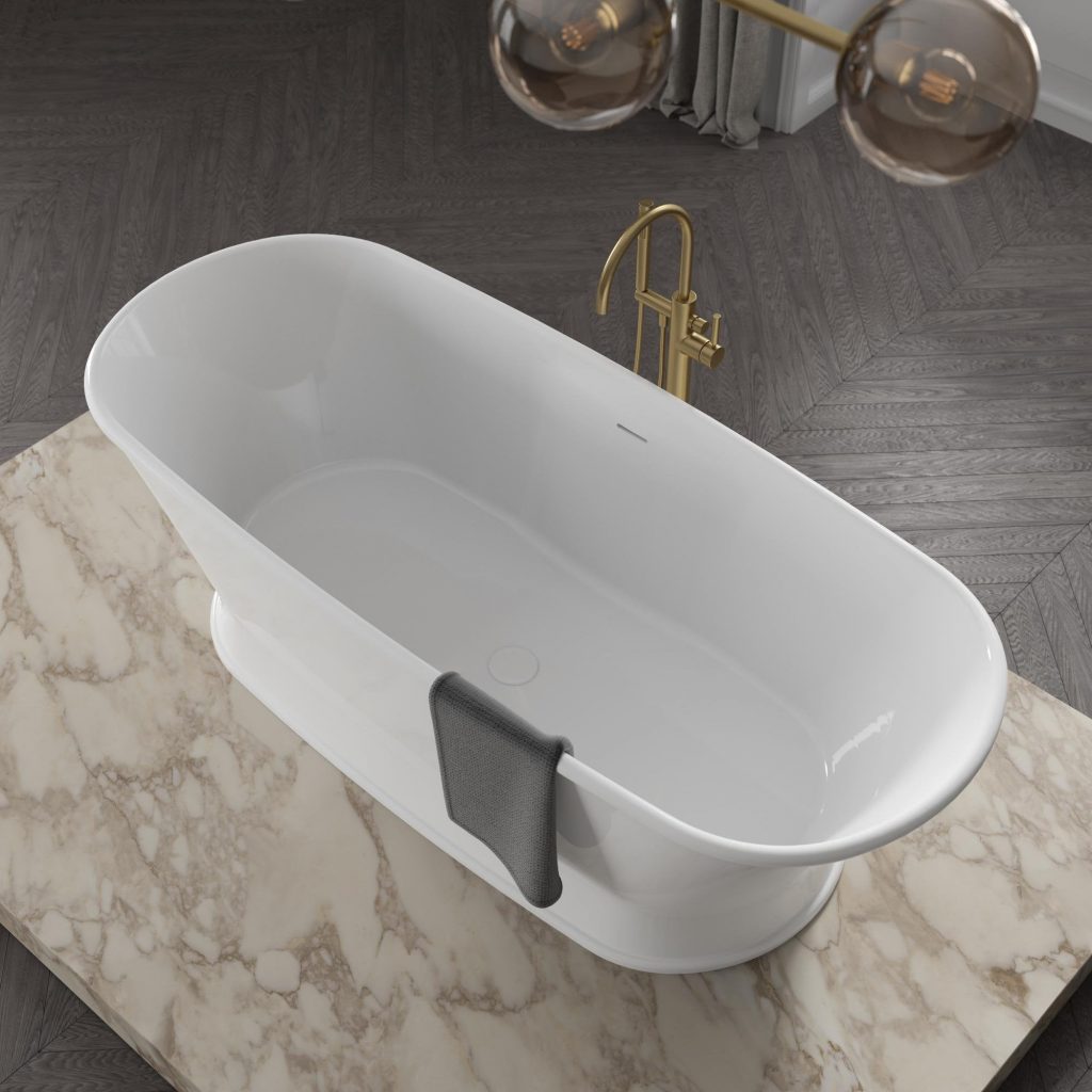 White stone bath with gold taps and black towel
