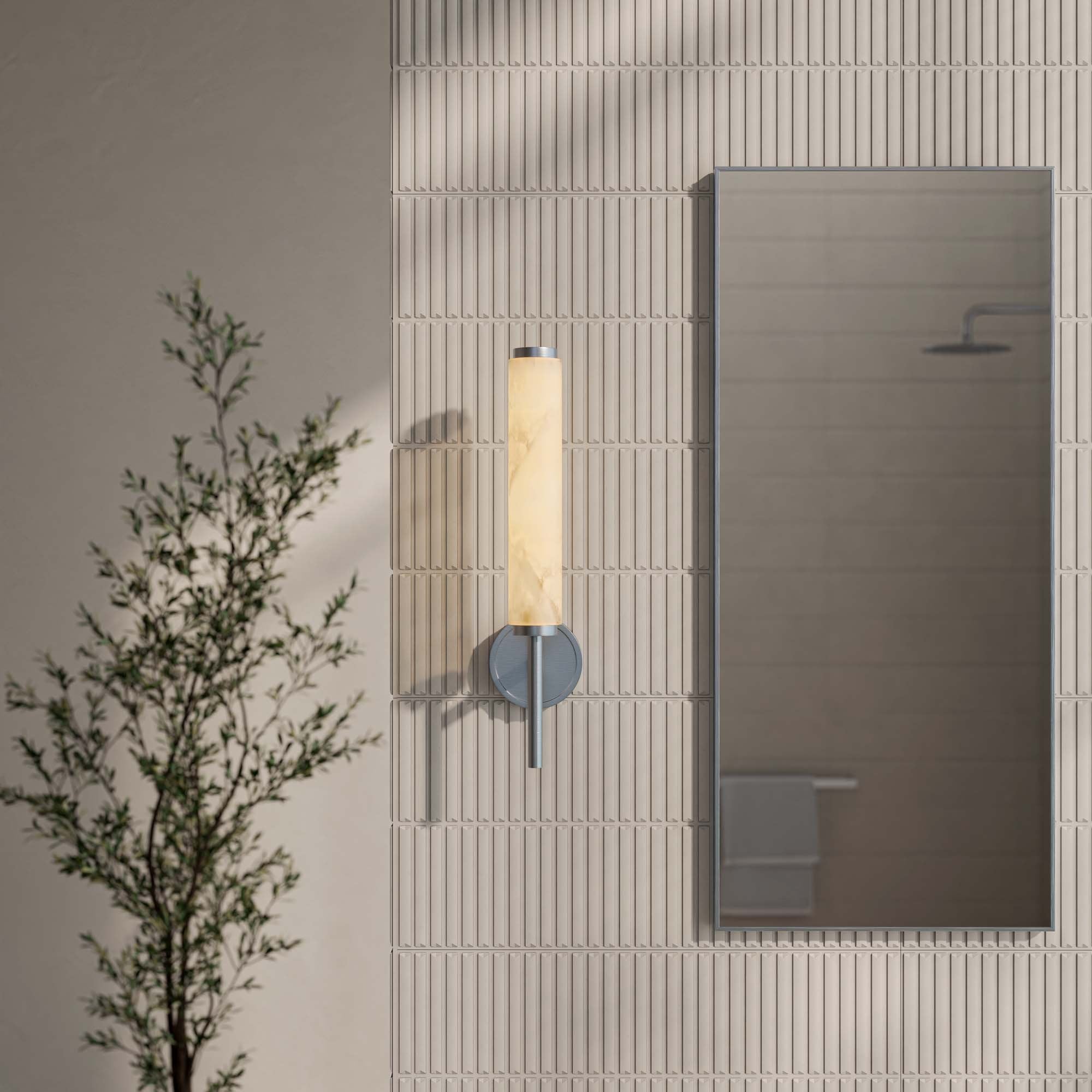 Brushed nickel wall sconce in modern bathroom